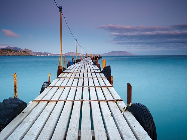 wood pier stretching over water