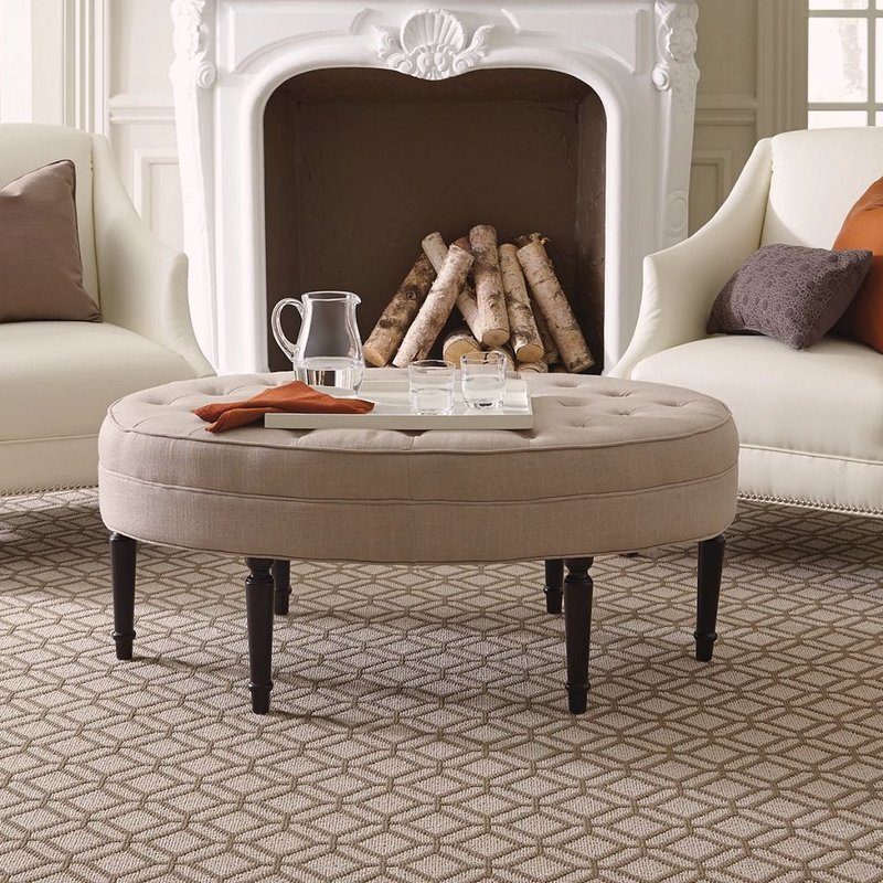 living room filled with furniture in front of a fireplace